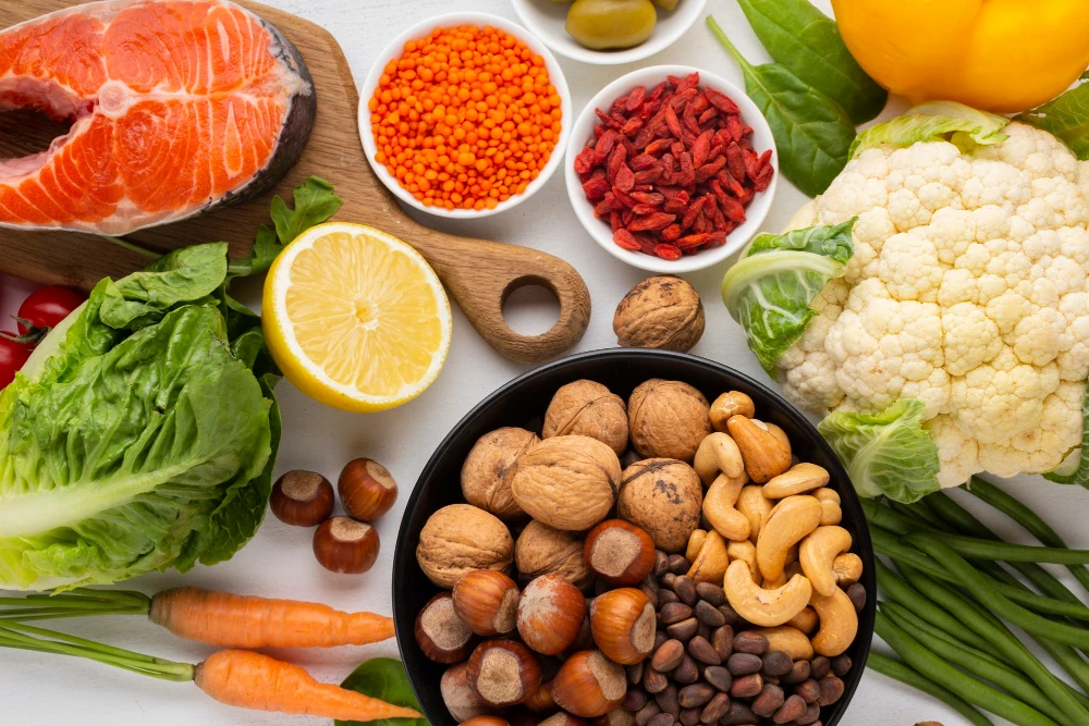 Vibrant flat lay of magnesium-rich foods by Rgenic: salmon, lentils, goji berries, nuts, greens – natural sources for wellness and supplements