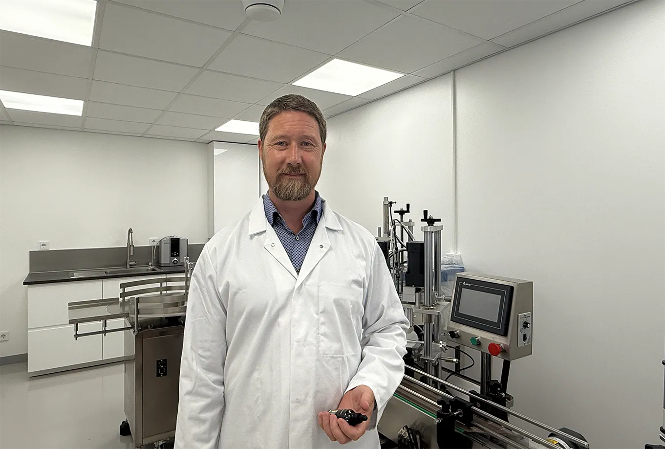 Daniel Englund, Rgenic founder, standing with product line